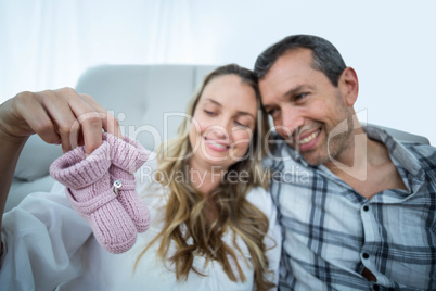 Pregnant couple sitting on floor