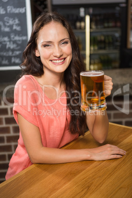 Pretty woman having a beer