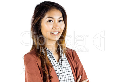 Smiling businesswoman with crossed arms