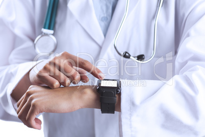 Asian doctor using her smart watch