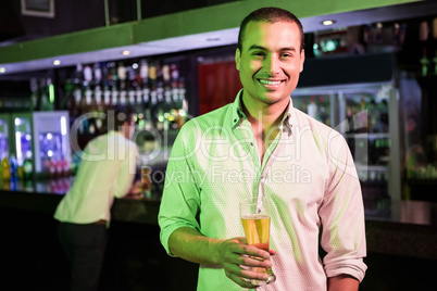 Man posing with glass of beer