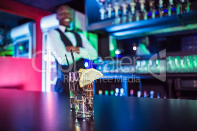 Two glasses of gin on bar counter