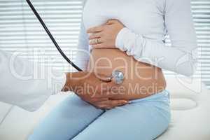 Doctor examining pregnant woman