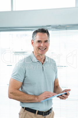 Happy man using digital table