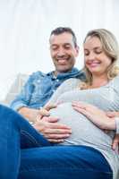 Couple sitting on sofa