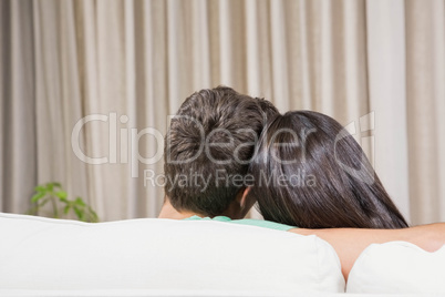 Couple at home relaxing on the sofa