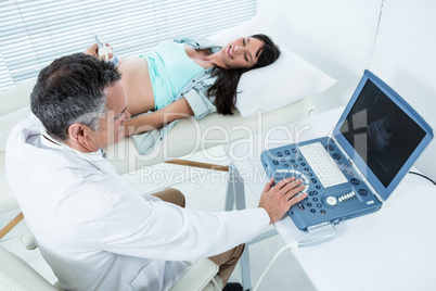 Pregnant woman undergoing ultrasound test