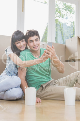 Young couple using mobile phone