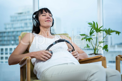 Pregnant woman sitting on chair