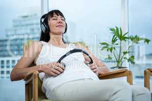 Pregnant woman sitting on chair