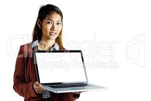 Smiling businesswoman showing a laptop