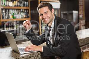 Handsome man using laptop computer