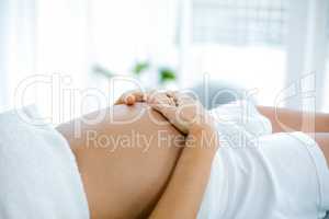 Pregnant woman relaxing on massage table
