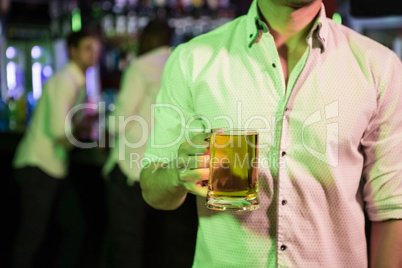 Man posing with glass of beer