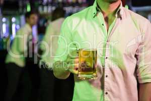 Man posing with glass of beer