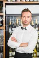 Handsome barman crossing his arms