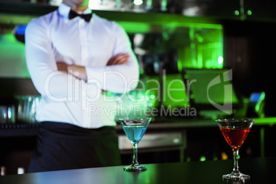 Two glasses of cocktail on bar counter