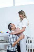 Man touching the belly of pregnant woman