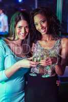 Happy women toasting champagne glasses