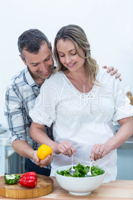 Pregnant couple in kitchen