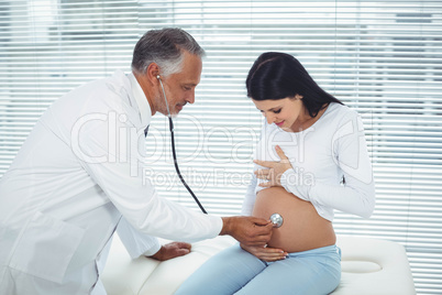 Doctor examining pregnant woman