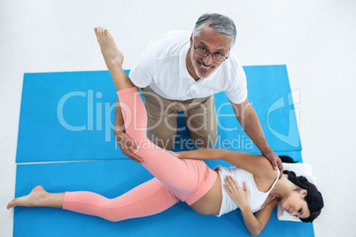 Doctor giving physiotherapy to pregnant woman