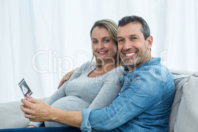 Couple looking at ultrasound scan