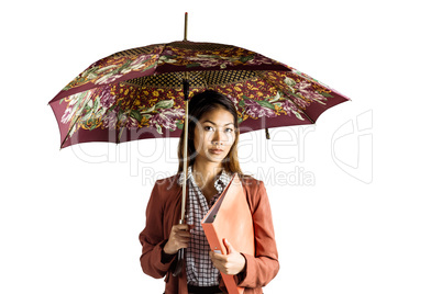 Businesswoman with an umbrella holding a binder