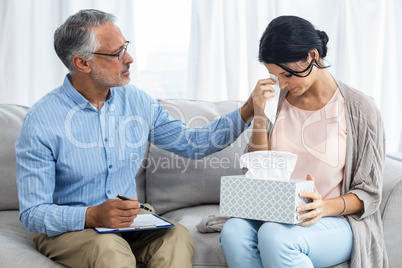 Therapist consoling a woman