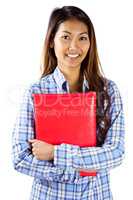 Smiling asian woman holding red book