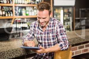 Handsome man using tablet computer