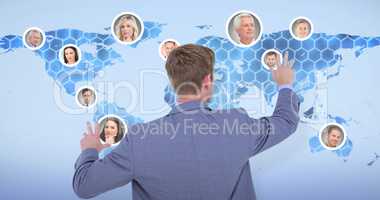 Composite image of back turned businessman gesturing with hands