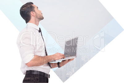 Composite image of sophisticated businessman standing using a la