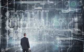 Composite image of businessman in suit looking through binocular