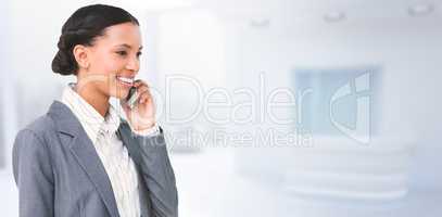 Composite image of smiling businesswoman using mobile phone