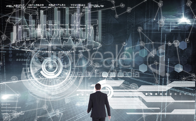 Composite image of rear view of businessman standing Composite image of rear view of businessman standing