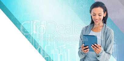 Composite image of businesswoman holding a tablet in the office