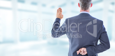 Composite image of rear view of businessman taking oath with fin