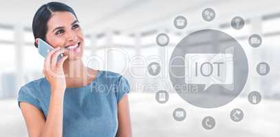 Composite image of beautiful businesswoman using mobile phone