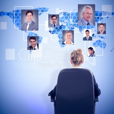 Composite image of businesswoman sitting on swivel chair