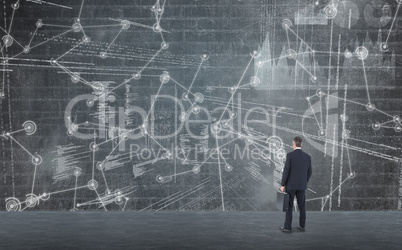 Composite image of businessman in suit holding a briefcase