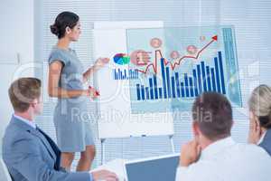Composite image of manager presenting statistics to her colleagu