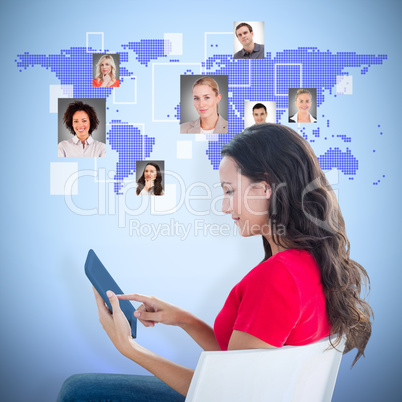 Composite image of woman sitting with tablet