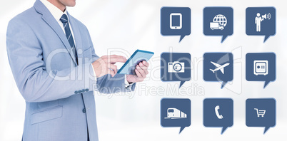 Composite image of businessman using tablet pc