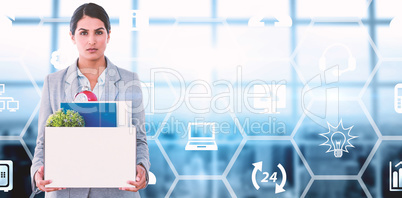 Composite image of fired businesswoman holding box of belongings