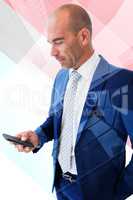 Composite image of businessman texting with his smartphone