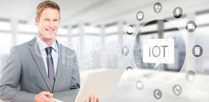 Composite image of happy businessman with laptop