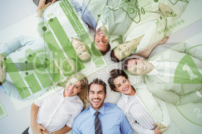 Composite image of young business people lying in circle
