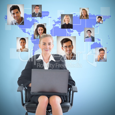 Composite image of businesswoman sitting on swivel chair with la