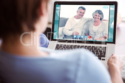 Composite image of pregnant woman using her laptop